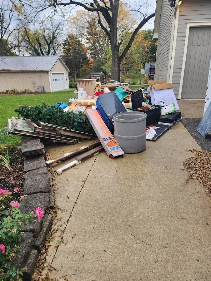 Dumpster being loaded with debris for Demolition Dumpster Rental in Palmyra